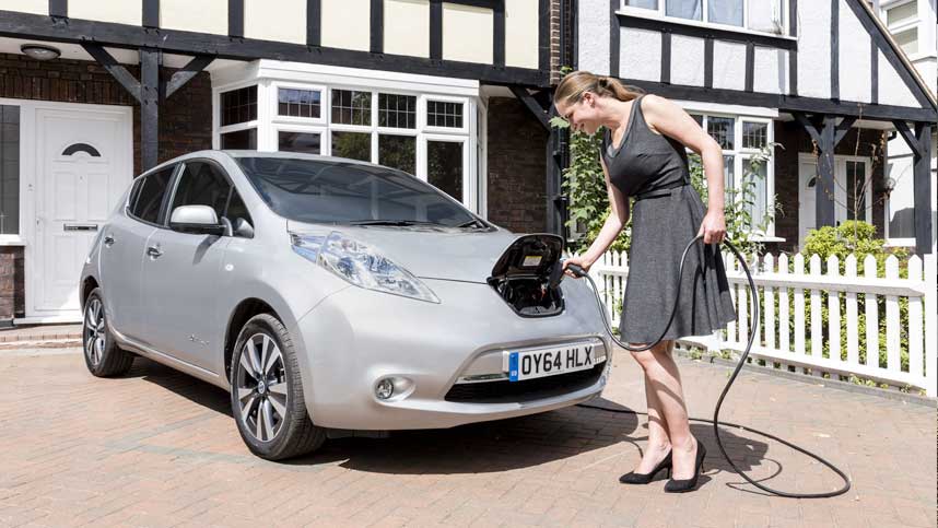 Woman Charging Nissan Leaf