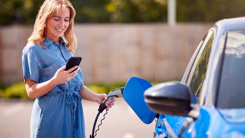 Woman Charging Electric Car