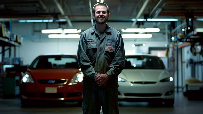Mechanic Stood in Front of ICE & EV